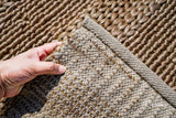 Natural beige jute rug in a minimalist decor setting
