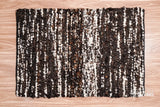 Handcarded wool rug styled in a living room