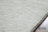 Ivory loop weave rug in natural daylight