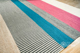 Wool rug shown at full size on wood flooring