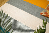 Handwoven striped wool rug full view on flooring