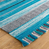 Teal blue kilim rug styled in living room