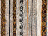 Ivory kilim rug styled in a bedroom setting