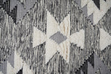 Grey wool rug in a bedroom setting