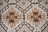 Brown beige rug corner detail with fringe edge