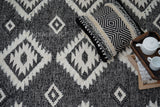 Handwoven black Moroccan Berber wool rug, flat lay view