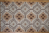 Brown beige kilim rug styled in a minimalist living room