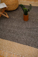 Charcoal grey and beige chunky loop rug flat lay