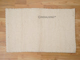 Close-up of ivory chunky wool loop texture