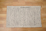 Beige wool rug corner and edge detail