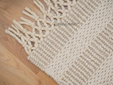 Ivory wool rug styled in a living room