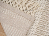 Close-up of ivory braided wool texture