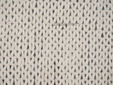 Ivory chunky wool rug styled in a living room setting
