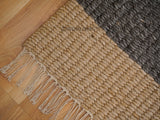 Rug corner detail showing charcoal grey tone