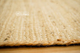 Jute rug shown in bedroom setting with natural light