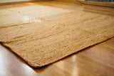 Jute rug styled with neutral home decor accents