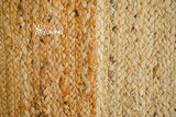 Full view of natural jute rug on wood floor