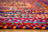 Colourful patchwork rug styled in a living room