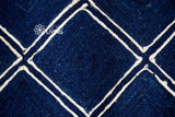 Navy jute rug styled with furniture in room