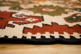 Southwestern Aztec kilim rug in a bohemian bedroom
