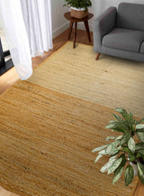 Jute area rug placed under coffee table in room decor