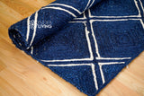 Navy jute rug styled in a living room