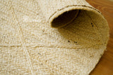 Ivory jute braided rug flat lay
