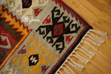 Full view of colourful kilim rug on floor
