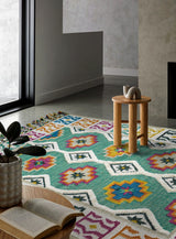 Close-up of green kilim weave and tassel detail