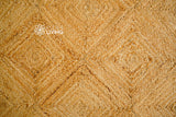 Jute braided rug in entryway setting