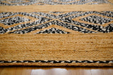 Full-length overhead view of black and white rag rug