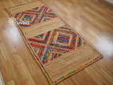 Black and white rag rug lifestyle shot in a bedroom