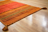 Orange kilim rug in natural light