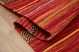 Red striped kilim rug, flat lay view
