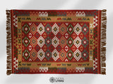Red traditional kilim rug in entryway setting