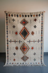 Overhead view of Moroccan print pattern on ivory rug
