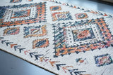 Off white jute rug styled in an entryway