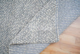 Grey wool rug in cozy styled room