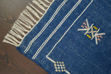 Full-length overhead view of blue Aztec kilim rug