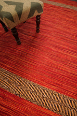 Red kilim rug styled in a living room setting