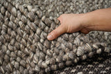 Charcoal brown chunky looped wool rug, flat lay view