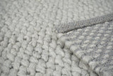 Wool rug styled in a Scandinavian living room