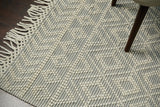 Close-up of chunky wool pile texture on diamond rug