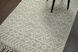 Diamond loop wool rug styled in a living room