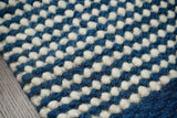 Bohemian blue wool rug weave close-up
