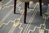 Gray bohemian tasseled wool rug, full flat view