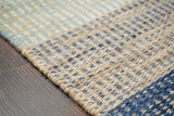 Rug corner detail showing blue stripe pattern