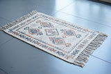 Close-up of handwoven jute pile texture on ivory rug