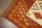 Kilim rug shown in bedroom setting with natural light