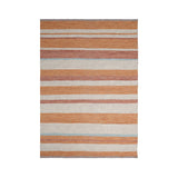Orange kilim rug styled in modern living room